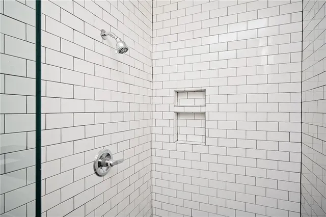 a view of an empty room with wooden walls