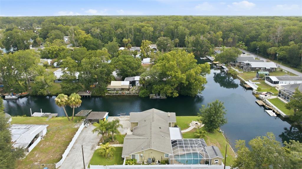 6355 Sebring Street Weeki Wachee, FL 34607 - Photo 59 of 65 a view of a lake with a house