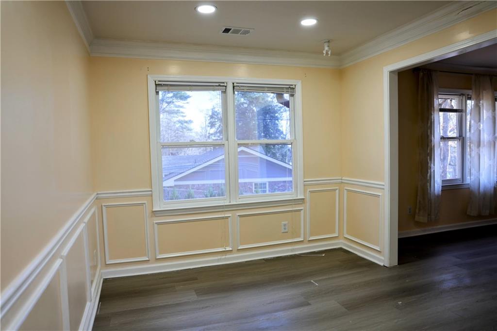 4296 Linda Lane Southwest Lilburn, GA 30047 - Photo 19 of 29 an empty room with wooden floor and windows