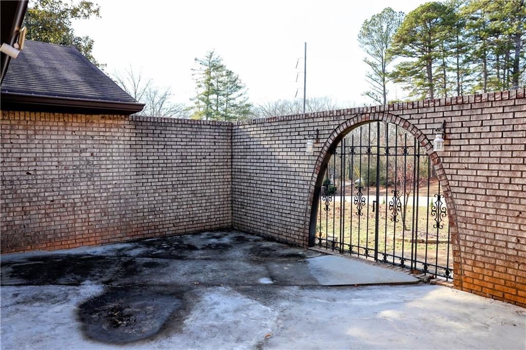 4296 Linda Lane Southwest Lilburn, GA 30047 - Photo 29 of 29 a view of a pathway along a building