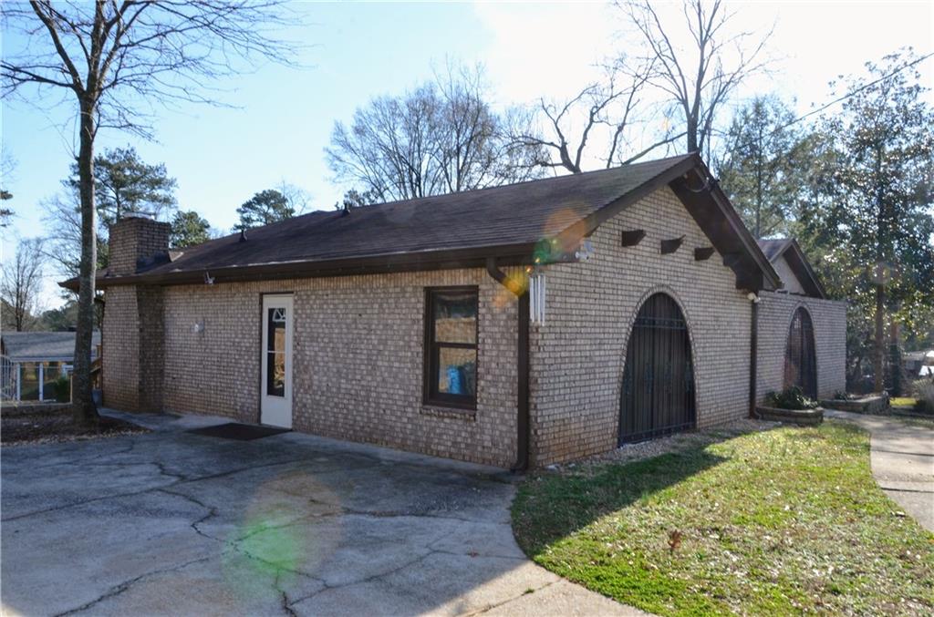 4296 Linda Lane Southwest Lilburn, GA 30047 - Photo 3 of 29 a front view of house with yard