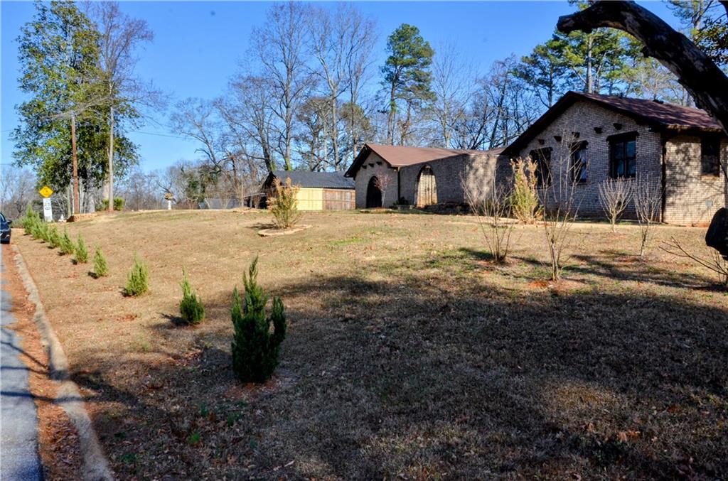 4296 Linda Lane Southwest Lilburn, GA 30047 - Photo 4 of 29 a view of a yard with snow on the road