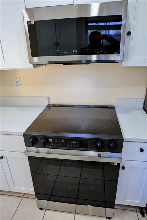 4296 Linda Lane Southwest Lilburn, GA 30047 - Photo 7 of 29 a close view of stove top oven
