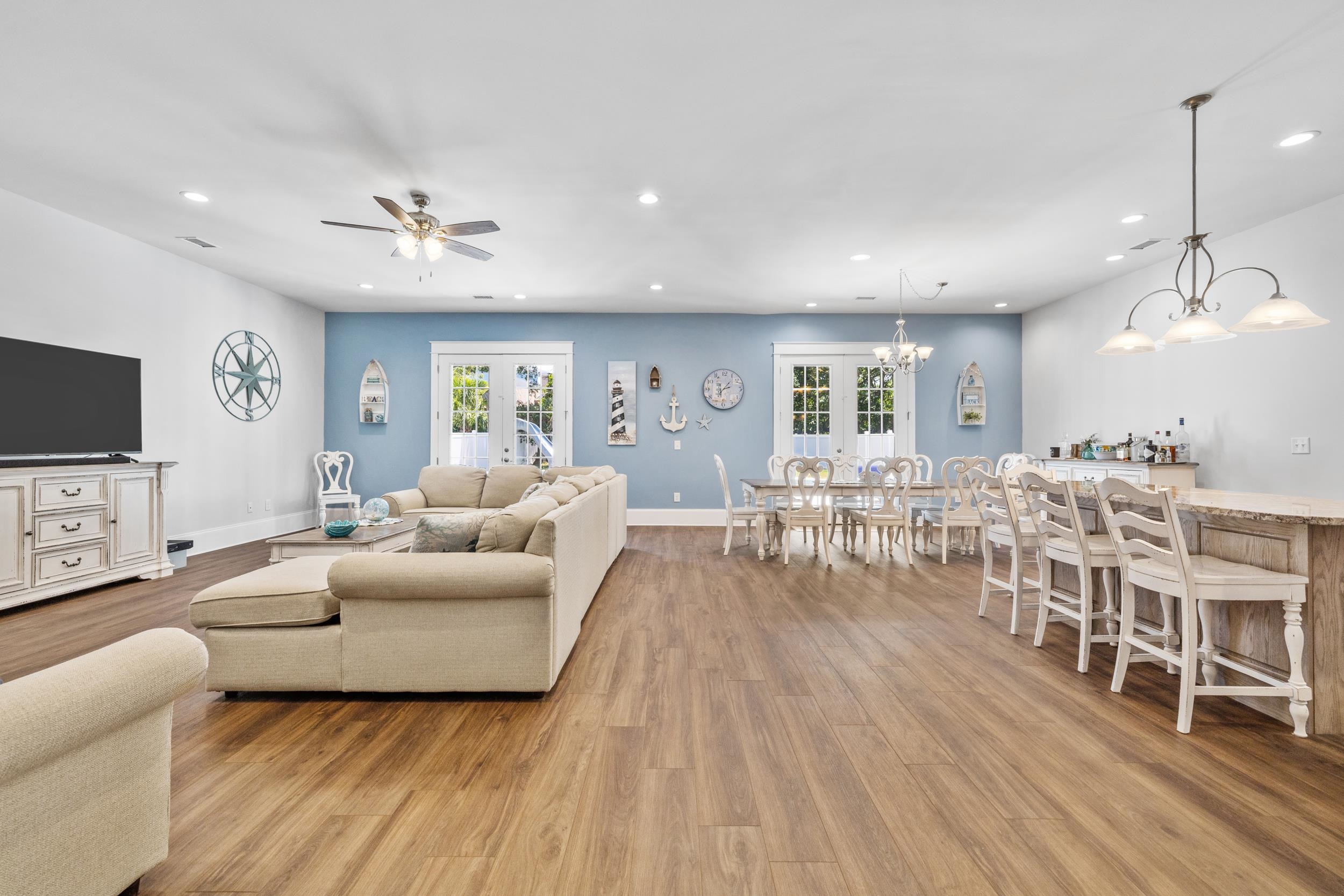 5907 Haskell Circle Myrtle Beach, SC 29577 - Photo 5 of 38 Living area with light wood-style flooring, recessed lighting, a ceiling fan, and a chandelier