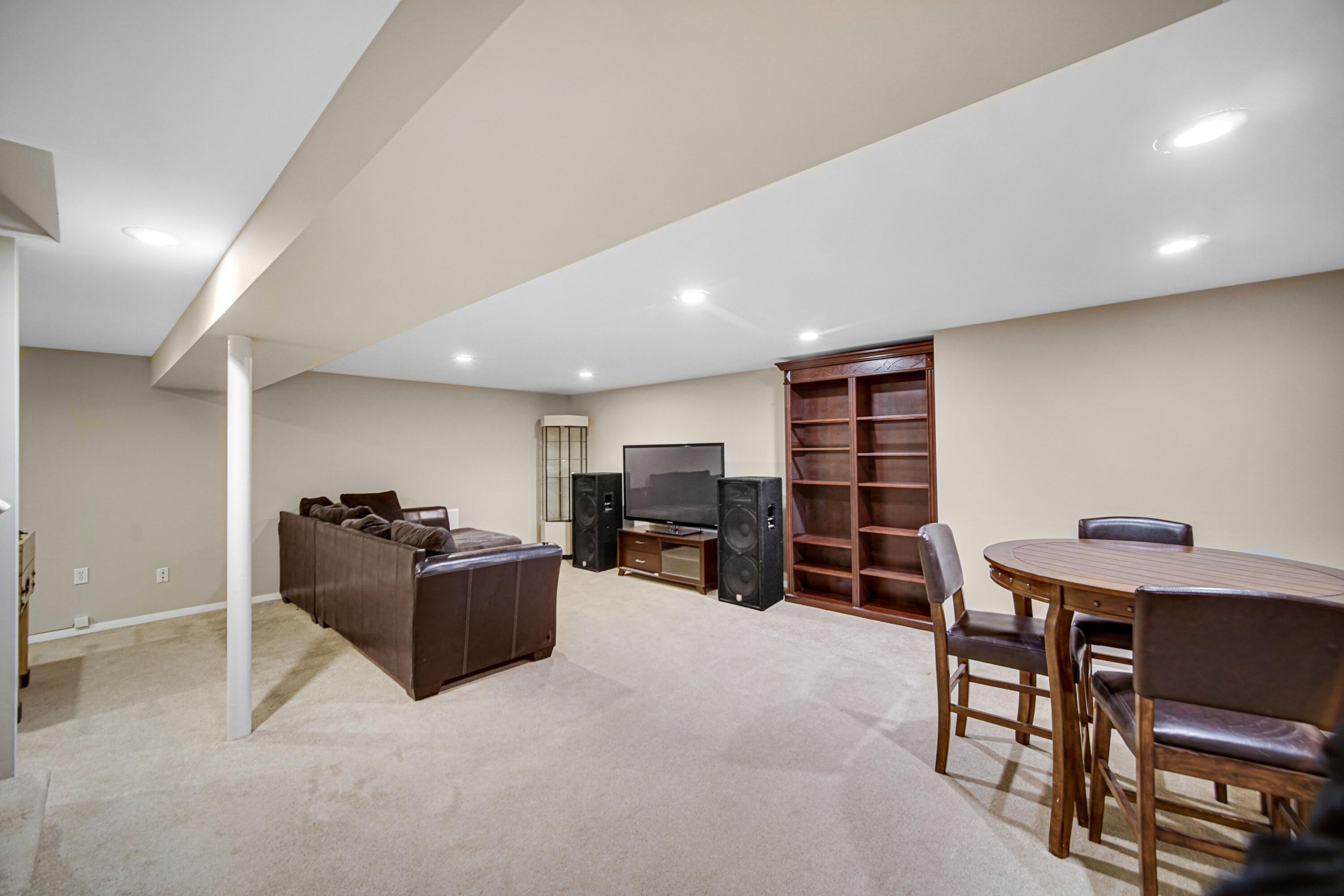 9418 Cleveland Street Crown Point, IN 46307 - Photo 15 of 22 a living room with furniture and a flat screen tv