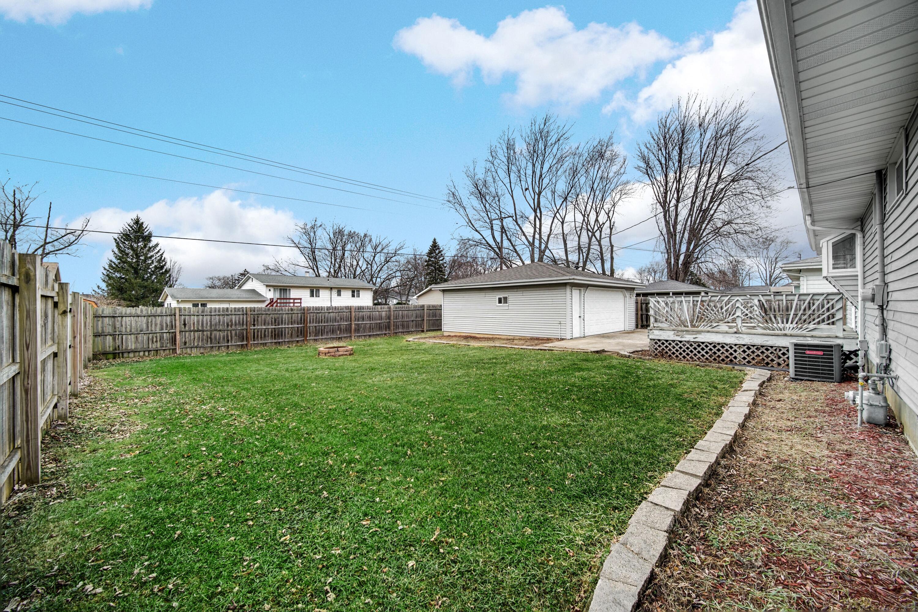 9418 Cleveland Street Crown Point, IN 46307 - Photo 20 of 22 a view of a house with a yard