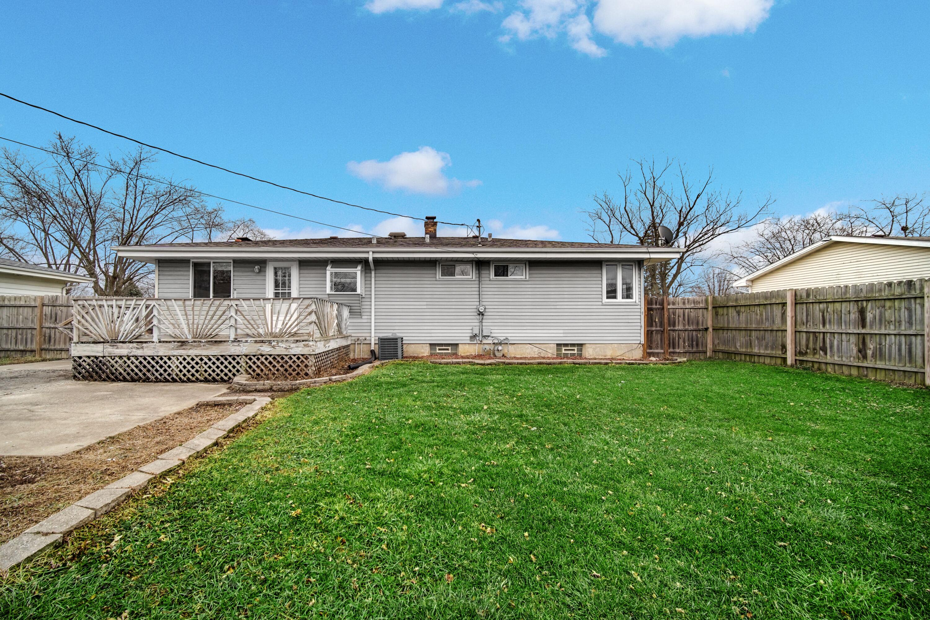 9418 Cleveland Street Crown Point, IN 46307 - Photo 22 of 22 a view of a house with a yard
