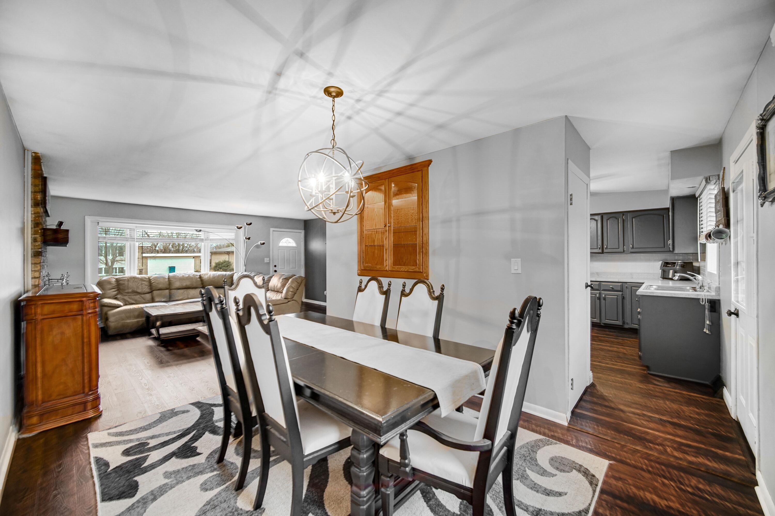 9418 Cleveland Street Crown Point, IN 46307 - Photo 5 of 22 a view of a dining room with furniture