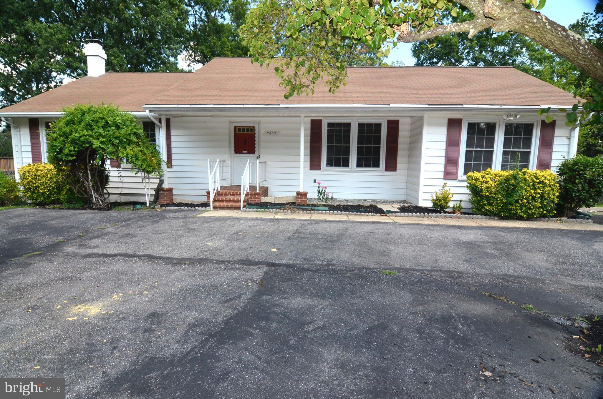 8604 Contee Road Laurel, MD 20708 - Photo 1 of 56 a front view of a house with a yard and glass windows