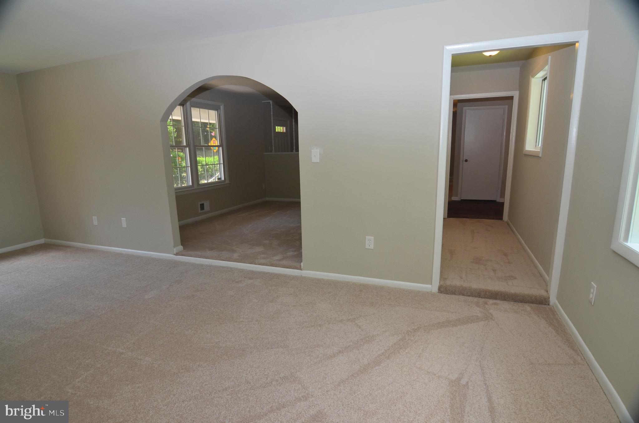 8604 Contee Road Laurel, MD 20708 - Photo 12 of 56 an empty room with a bathroom and mirror
