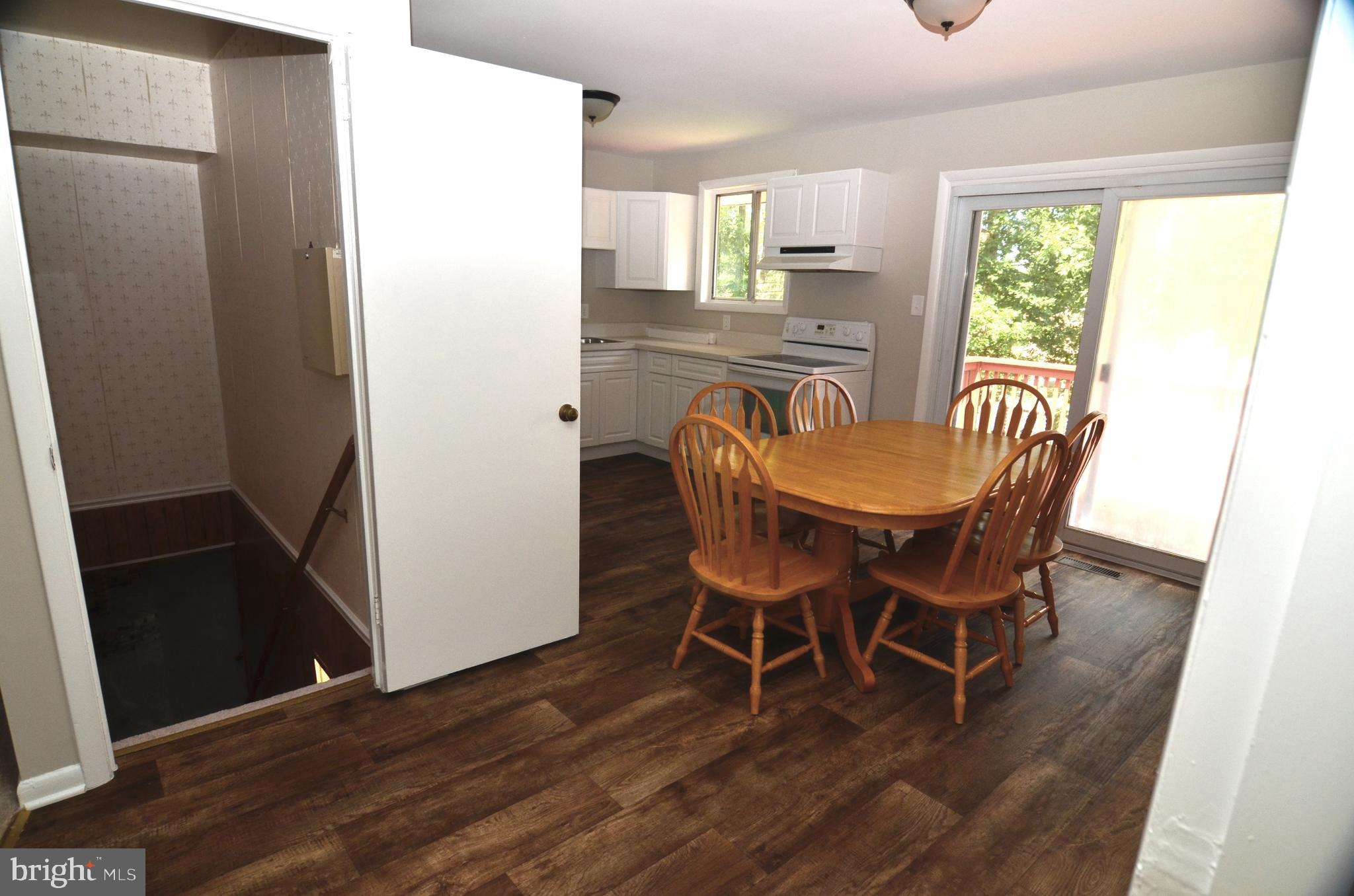 8604 Contee Road Laurel, MD 20708 - Photo 18 of 56 a dining room with furniture window wooden floor