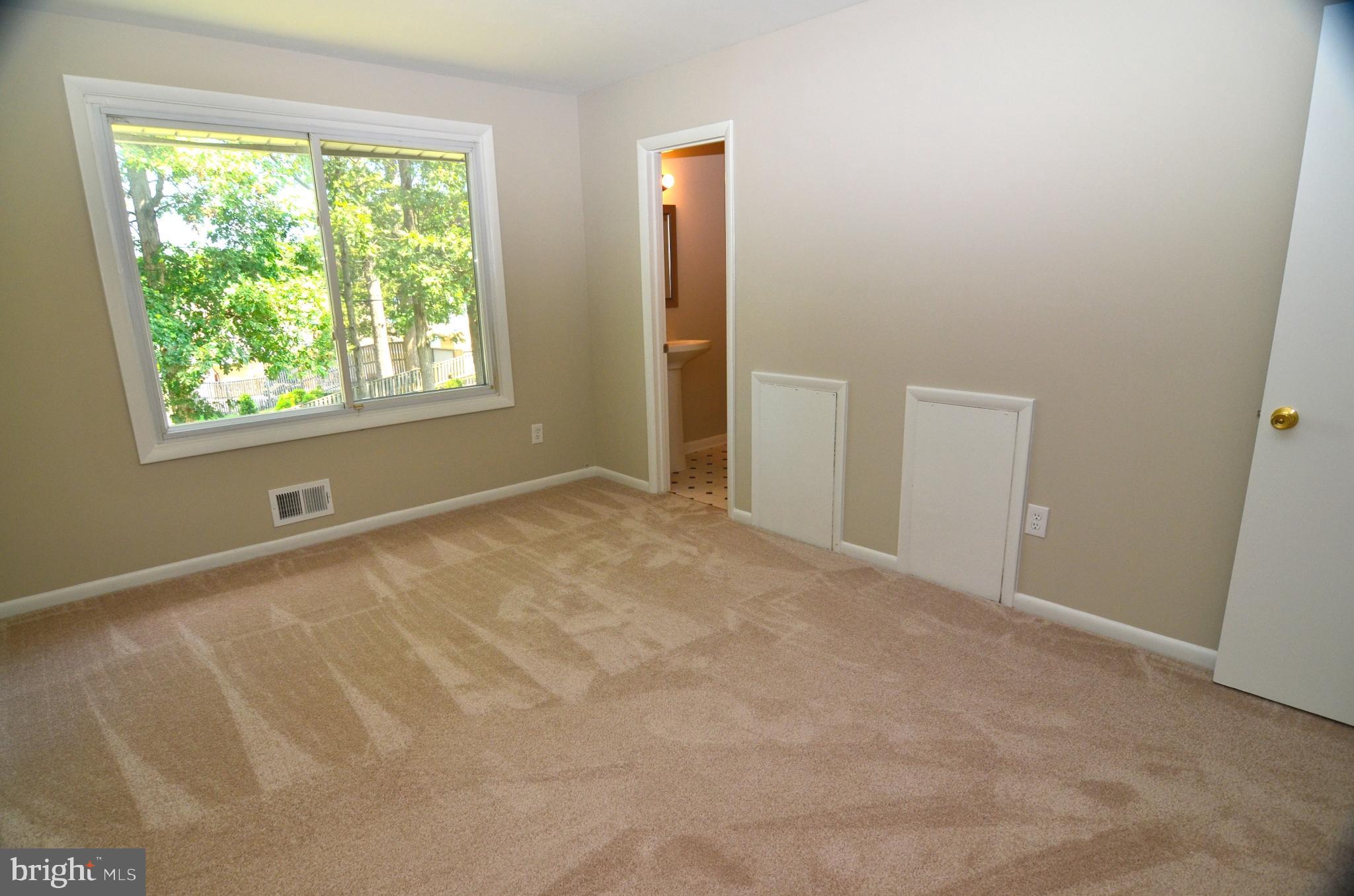 8604 Contee Road Laurel, MD 20708 - Photo 20 of 56 an empty room with windows and closet