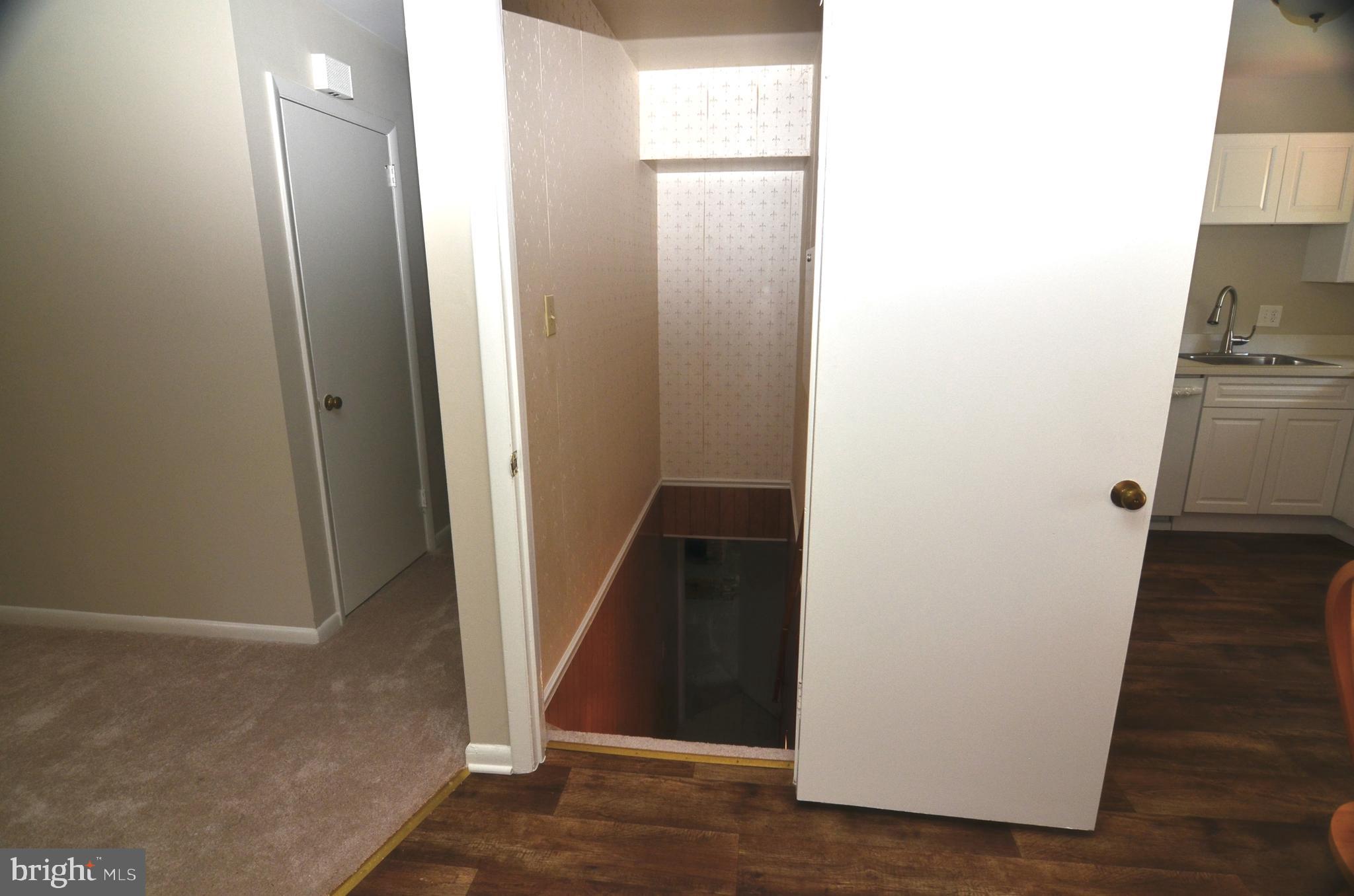 8604 Contee Road Laurel, MD 20708 - Photo 27 of 56 a view of a hallway with wooden floor