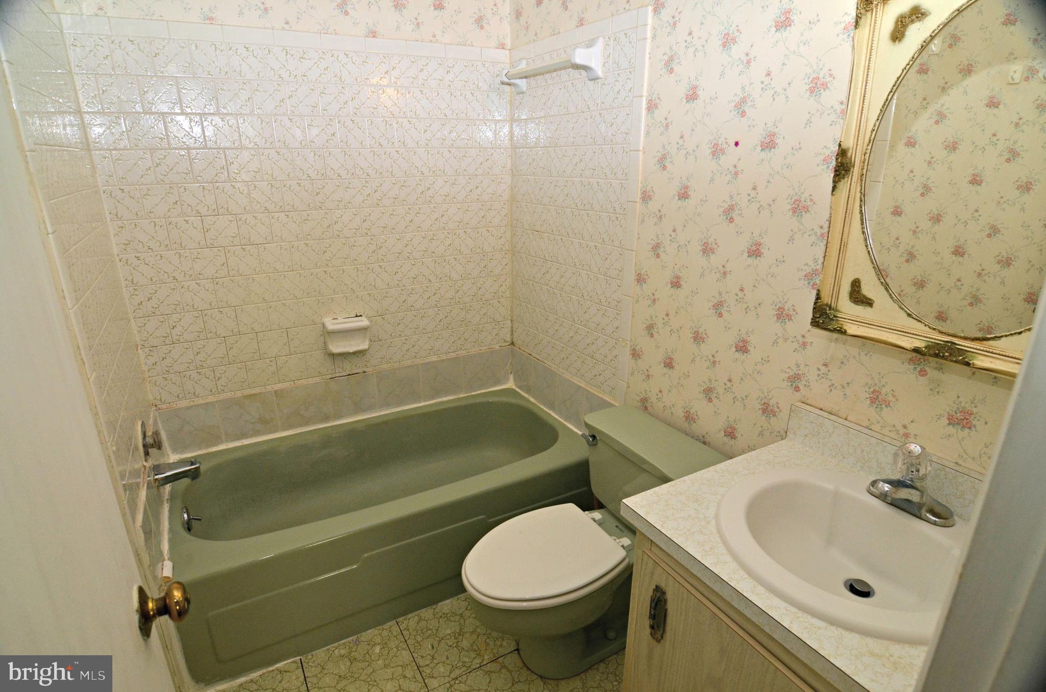 8604 Contee Road Laurel, MD 20708 - Photo 28 of 56 a bathroom with a sink toilet and shower