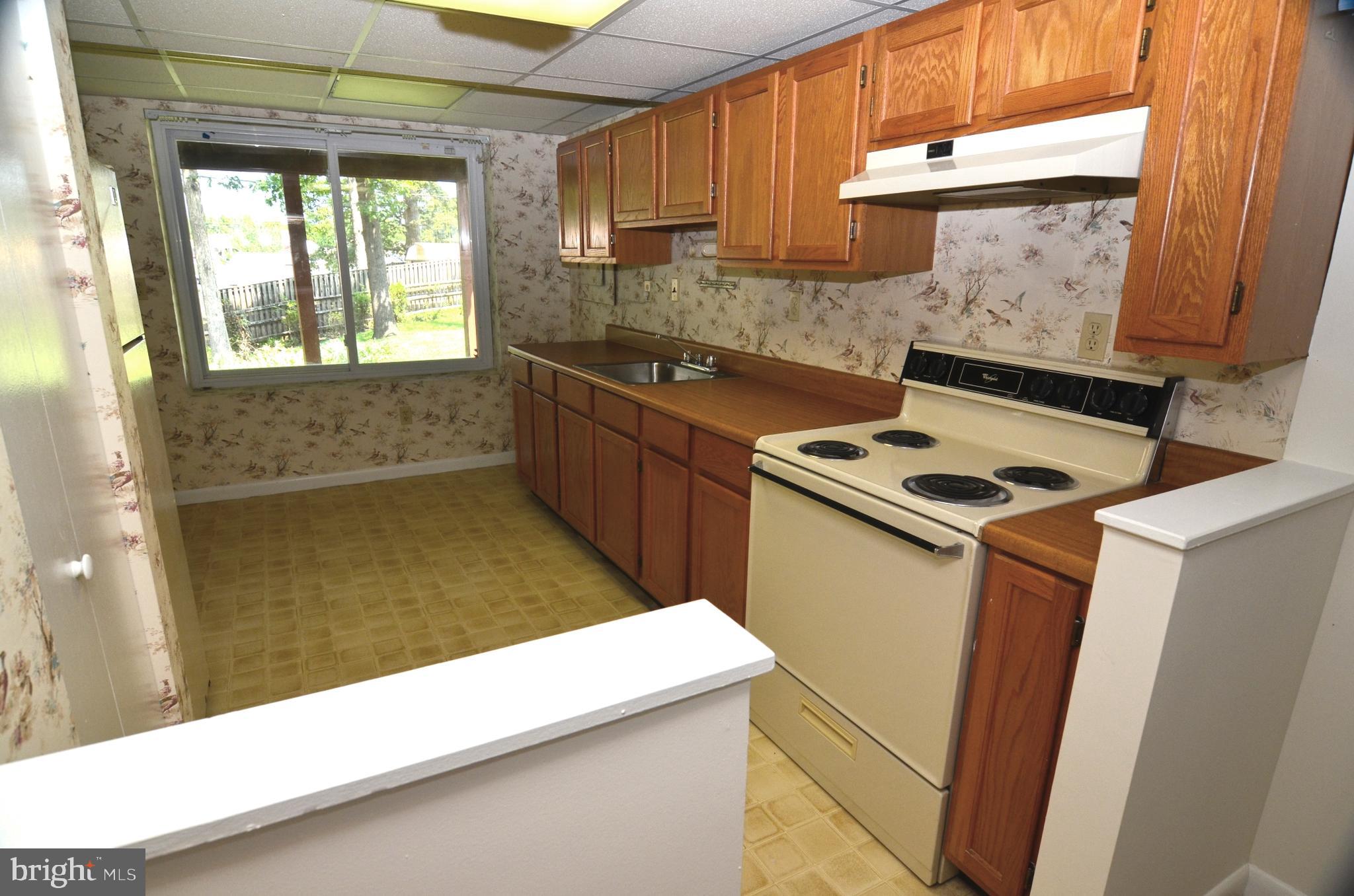 8604 Contee Road Laurel, MD 20708 - Photo 38 of 56 a kitchen that has a sink in it and a window