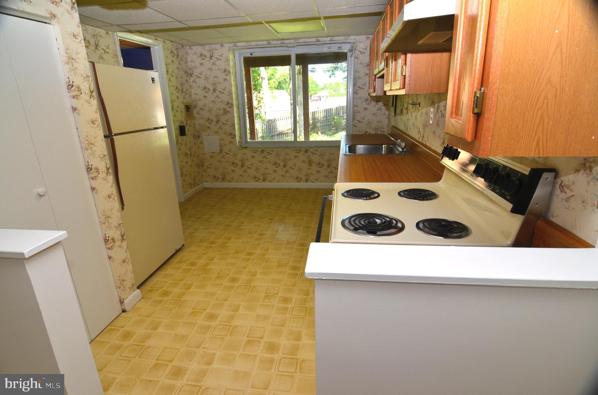 8604 Contee Road Laurel, MD 20708 - Photo 39 of 56 a close up of a sink and a refrigerator