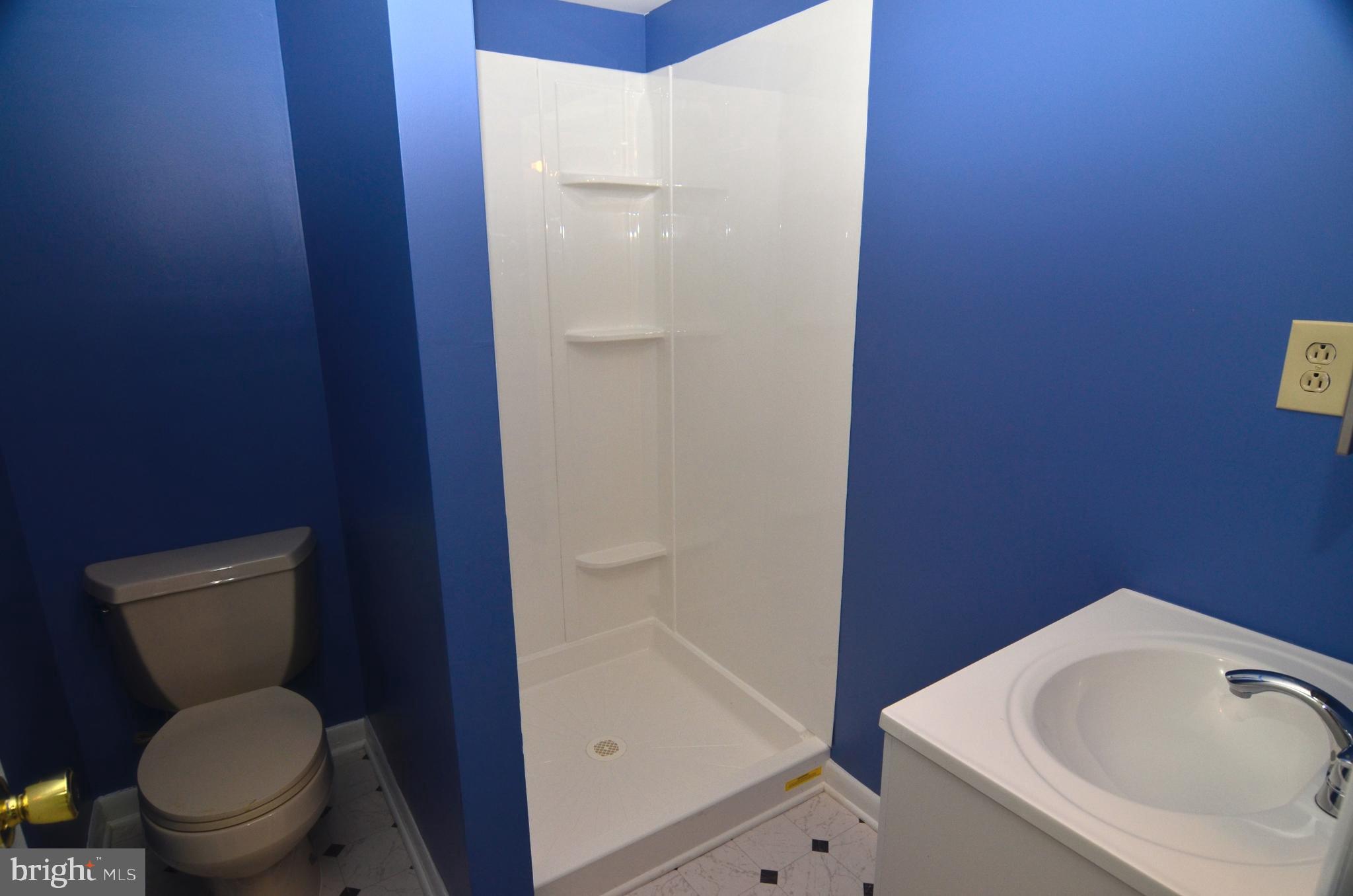 8604 Contee Road Laurel, MD 20708 - Photo 41 of 56 a white toilet sitting next to a bathroom sink