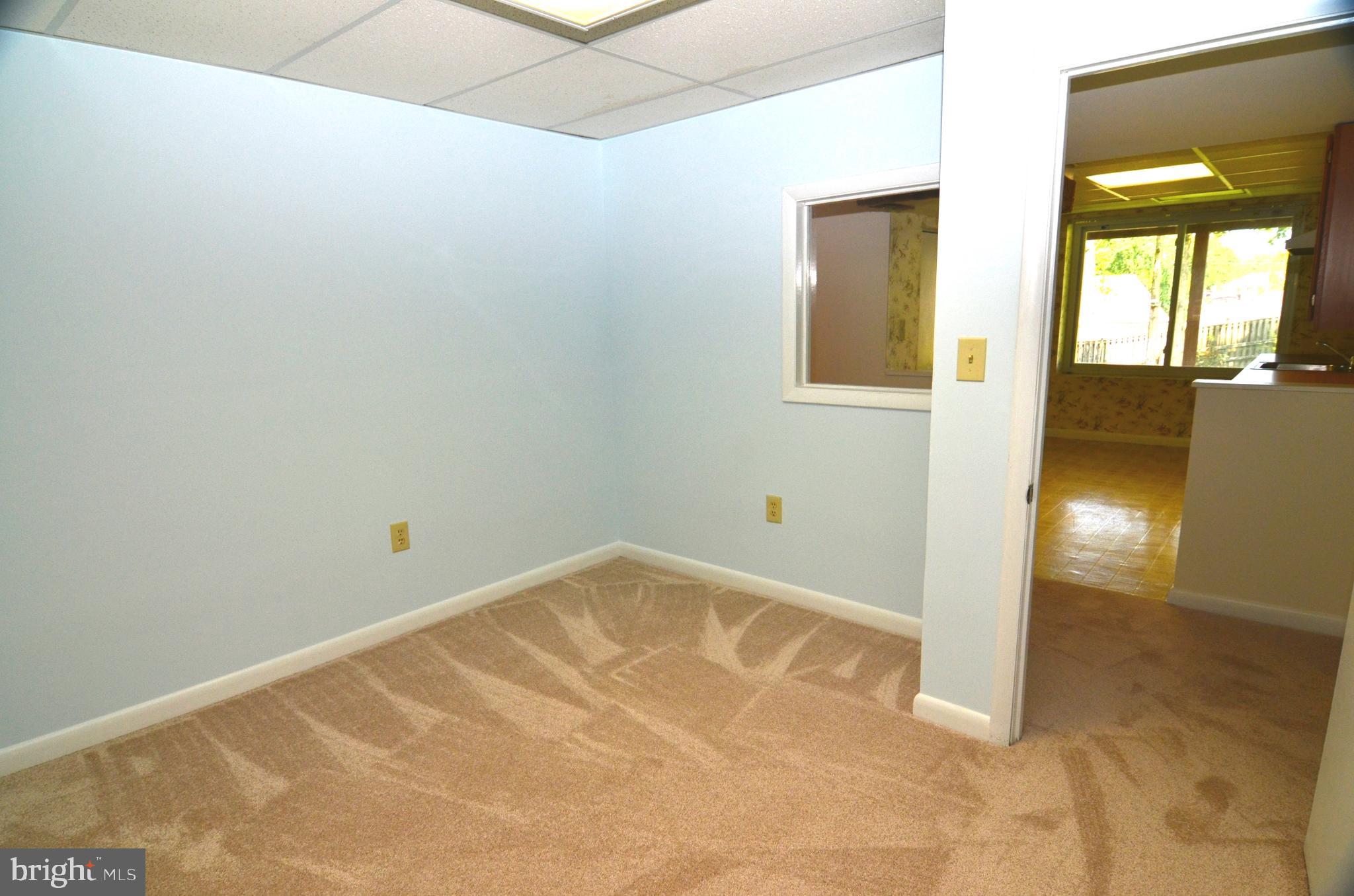 8604 Contee Road Laurel, MD 20708 - Photo 43 of 56 a view of a small space with wooden floor and a window
