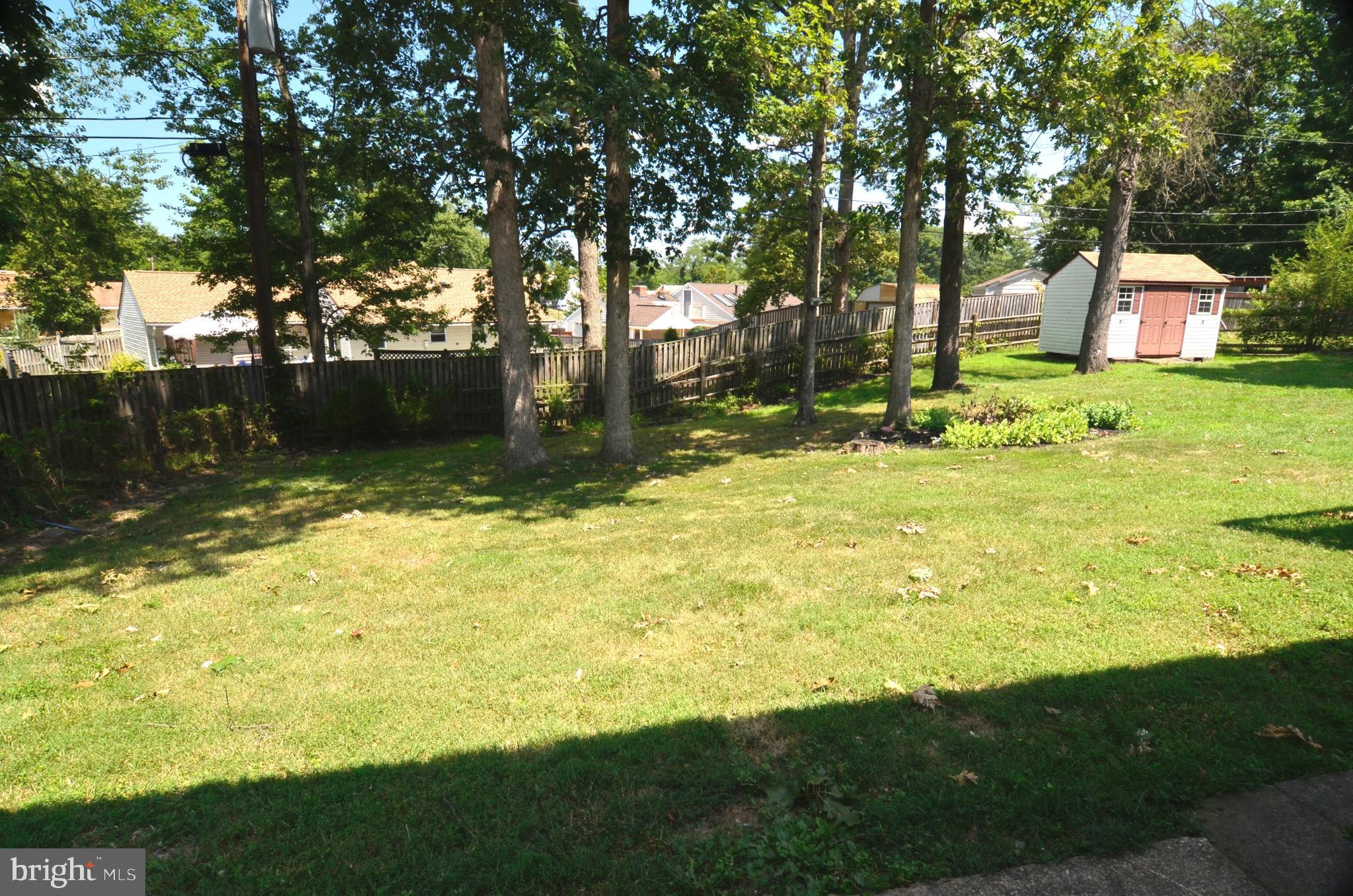 8604 Contee Road Laurel, MD 20708 - Photo 51 of 56 a view of a backyard with large trees