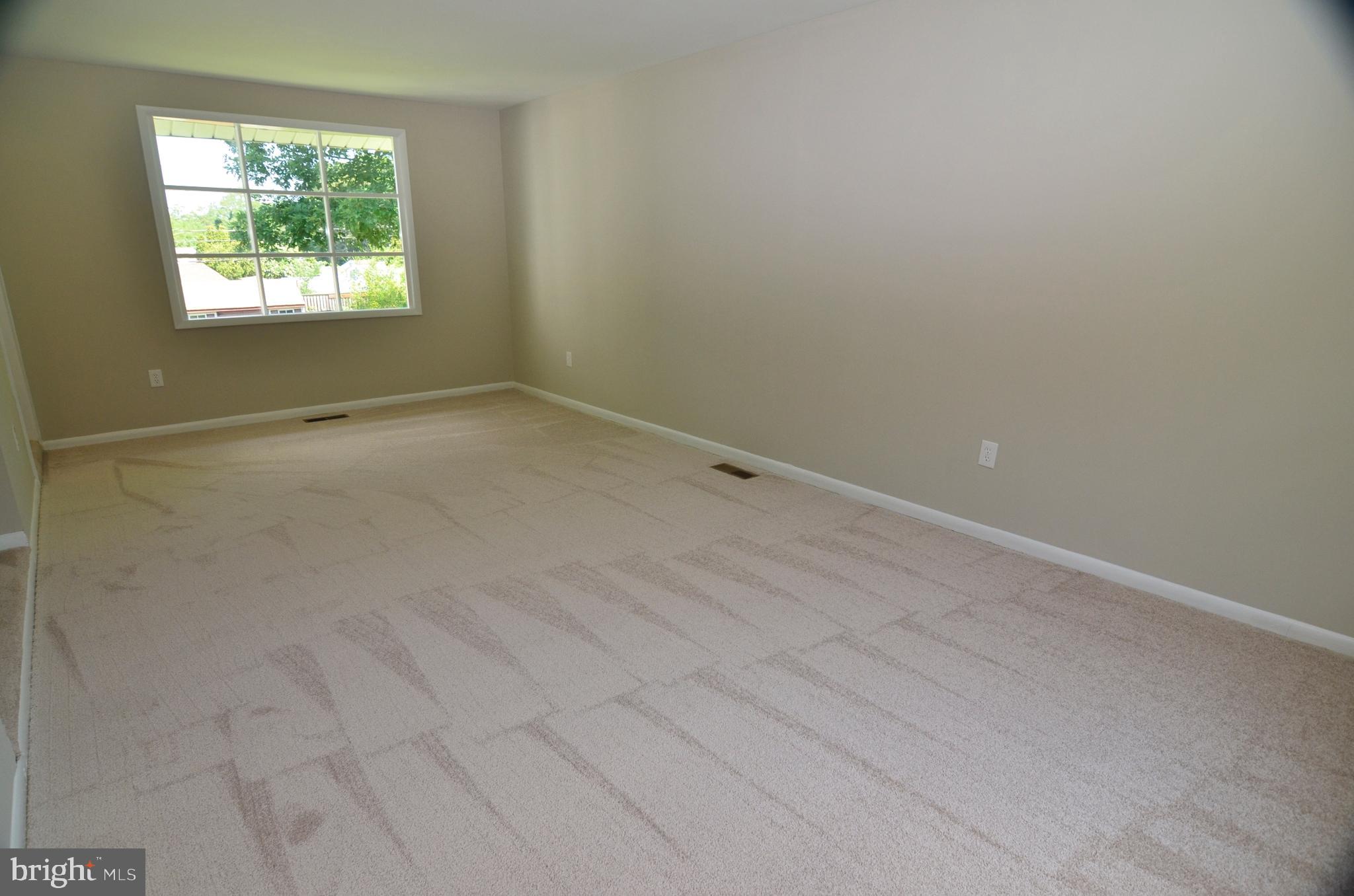 8604 Contee Road Laurel, MD 20708 - Photo 10 of 56 an empty room with a window