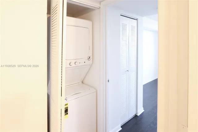 a bathroom with a granite countertop shower and a sink