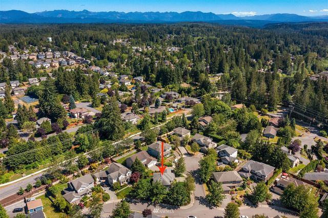 an aerial view of a city and mountain