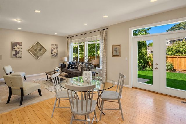 a view of a livingroom with furniture window and wooden floor