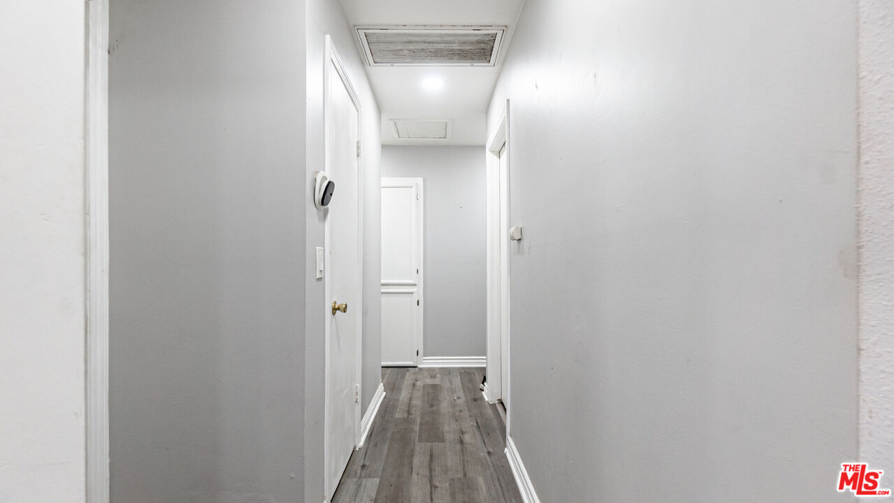 892 Vassar Street Pomona, CA 91767 - Photo 11 of 28 a view of a hallway with wooden floor