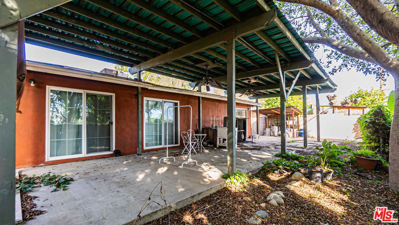 892 Vassar Street Pomona, CA 91767 - Photo 24 of 28 a view of a porch with chairs and potted plants