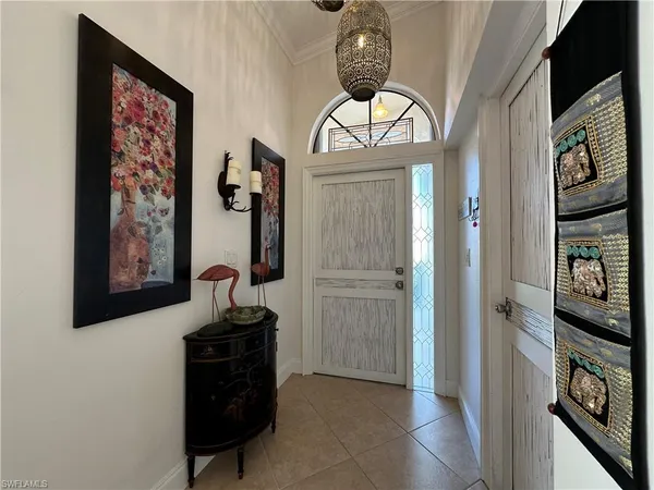 a view of a hallway with wooden floor and entryway