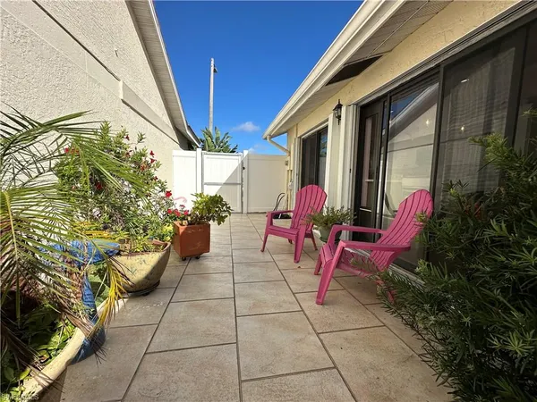 a building outdoor space with furniture and glass windows