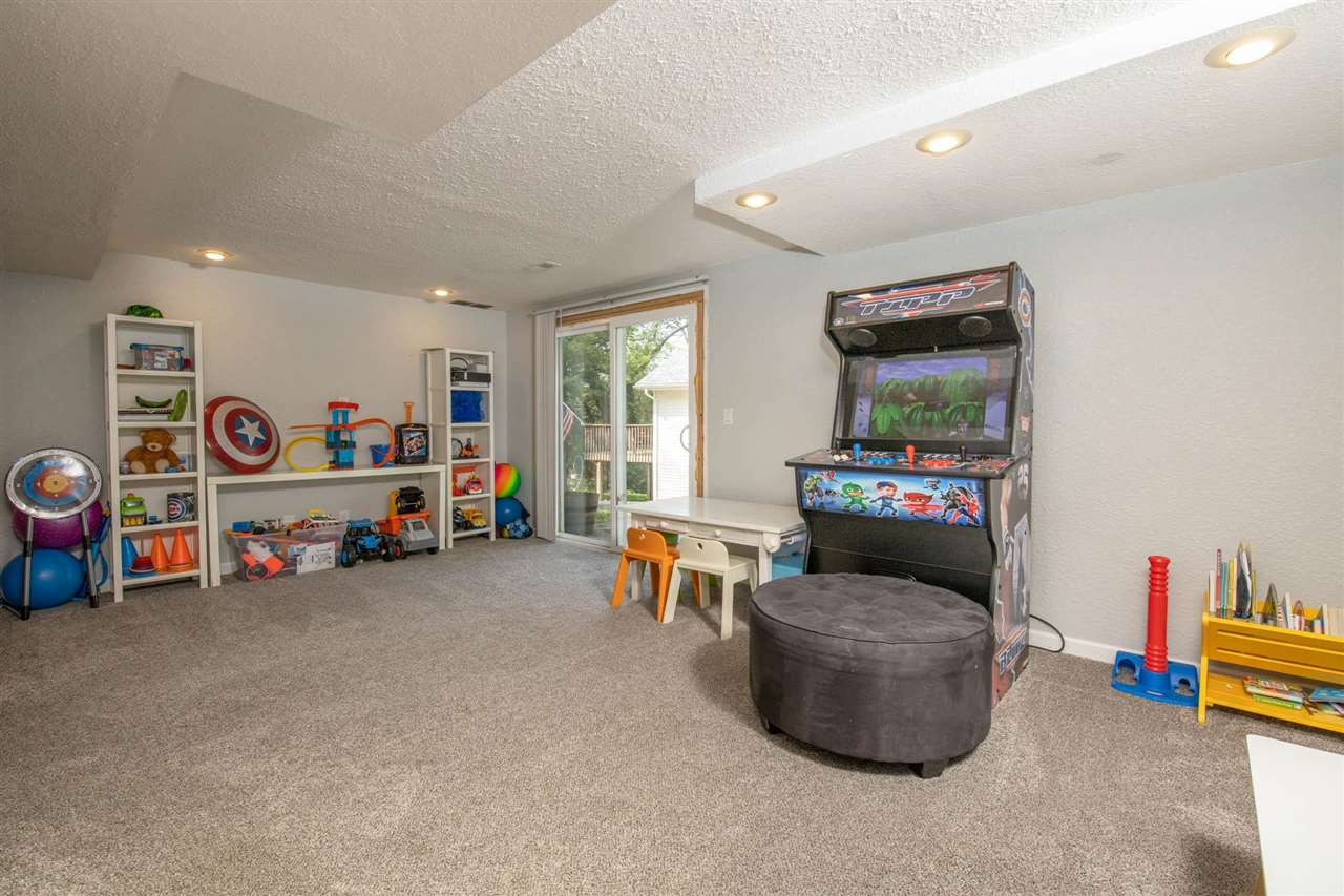 1088 Winborne Road Lake Summerset, IL 61019 - Photo 17 of 22 a living room with furniture and a flat screen tv