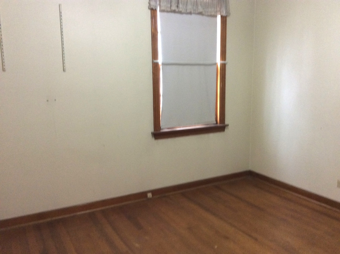 1436 Evergreen Road Homewood, IL 60430 - Photo 19 of 32 a view of a small space with wooden floor and a window