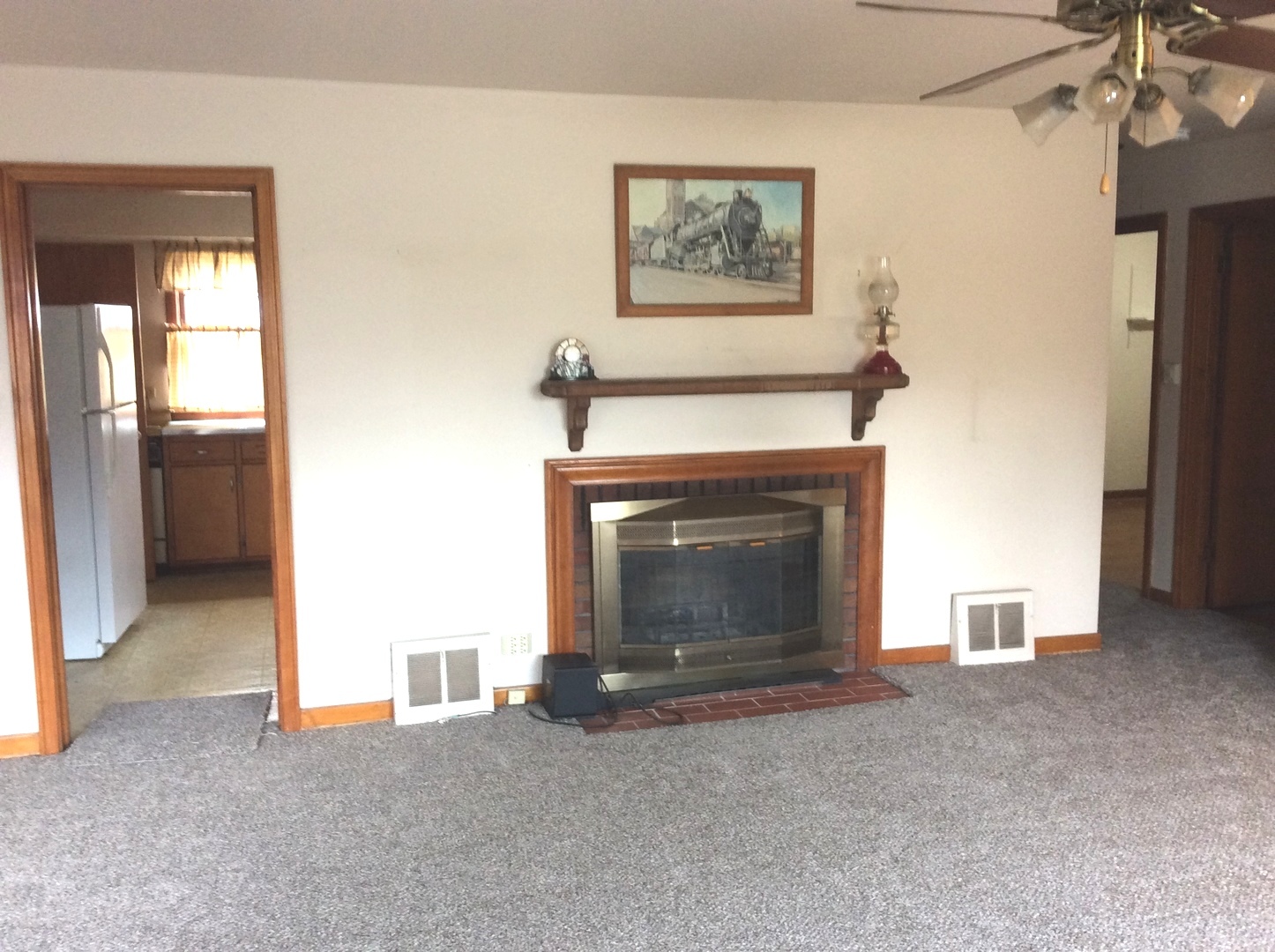 1436 Evergreen Road Homewood, IL 60430 - Photo 4 of 32 a view of an empty room with a fireplace and a window