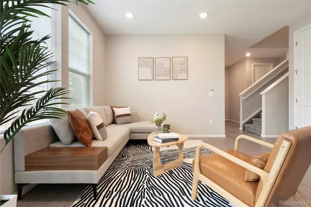a living room with furniture and a rug