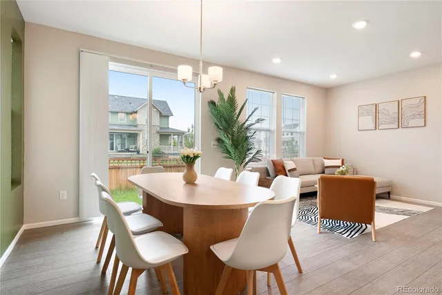 a dining room with furniture a livingroom and chandelier