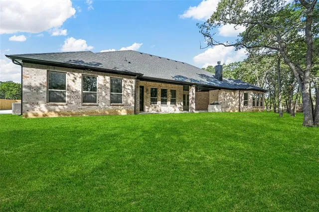 a front view of a house with garden and porch