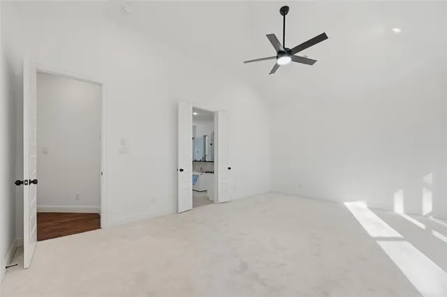 a view of a room with a ceiling fan