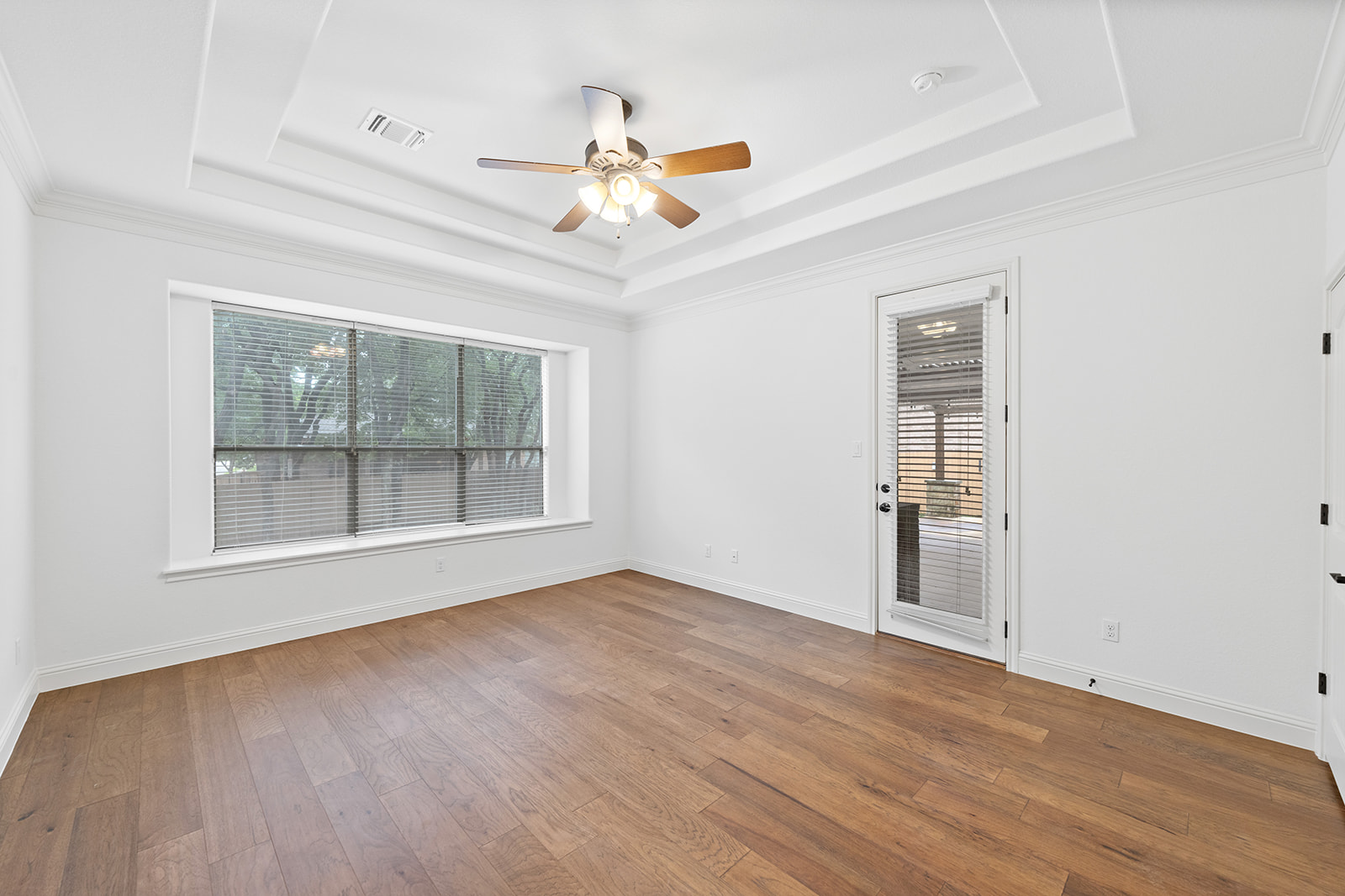114 North Saddle Ridge Drive Cedar Park, TX 78613 - Photo 17 of 40 a view of an empty room with a window and wooden floor
