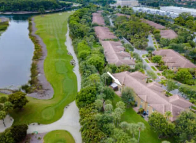 an aerial view of house with yard