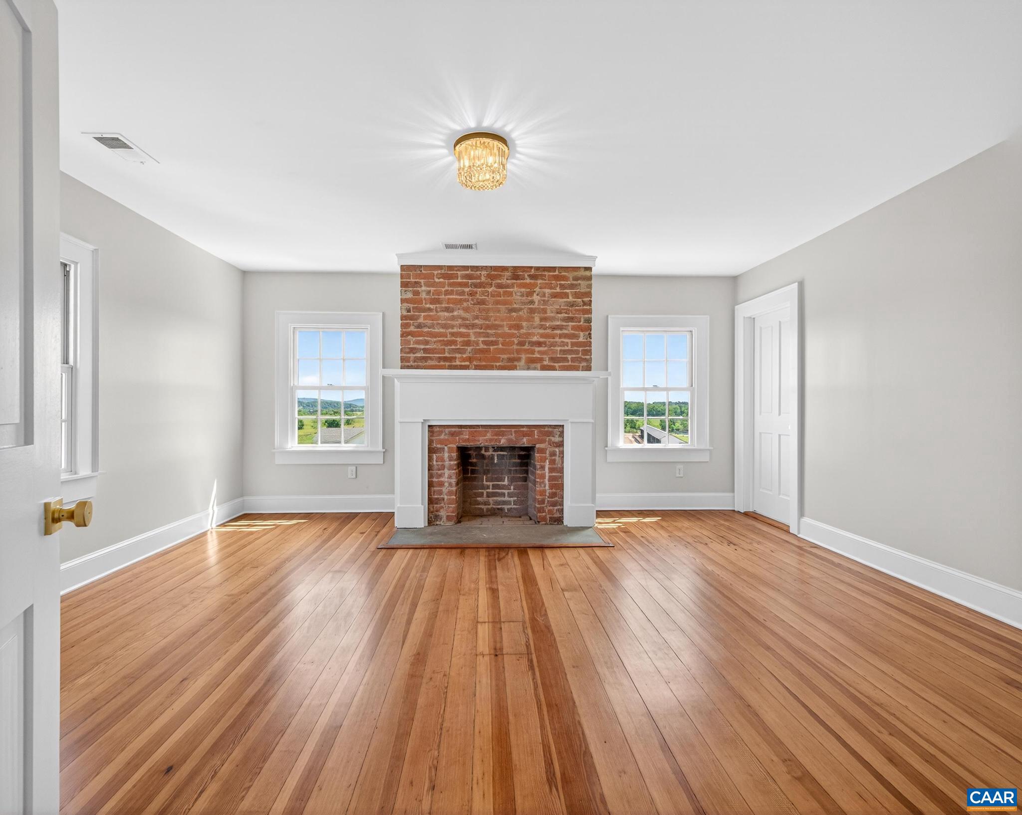 481 Race Ground Road Somerset, VA 22972 - Photo 27 of 53 a view of an empty room with wooden floor and a window