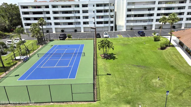a view of a swimming pool with a table and chairs