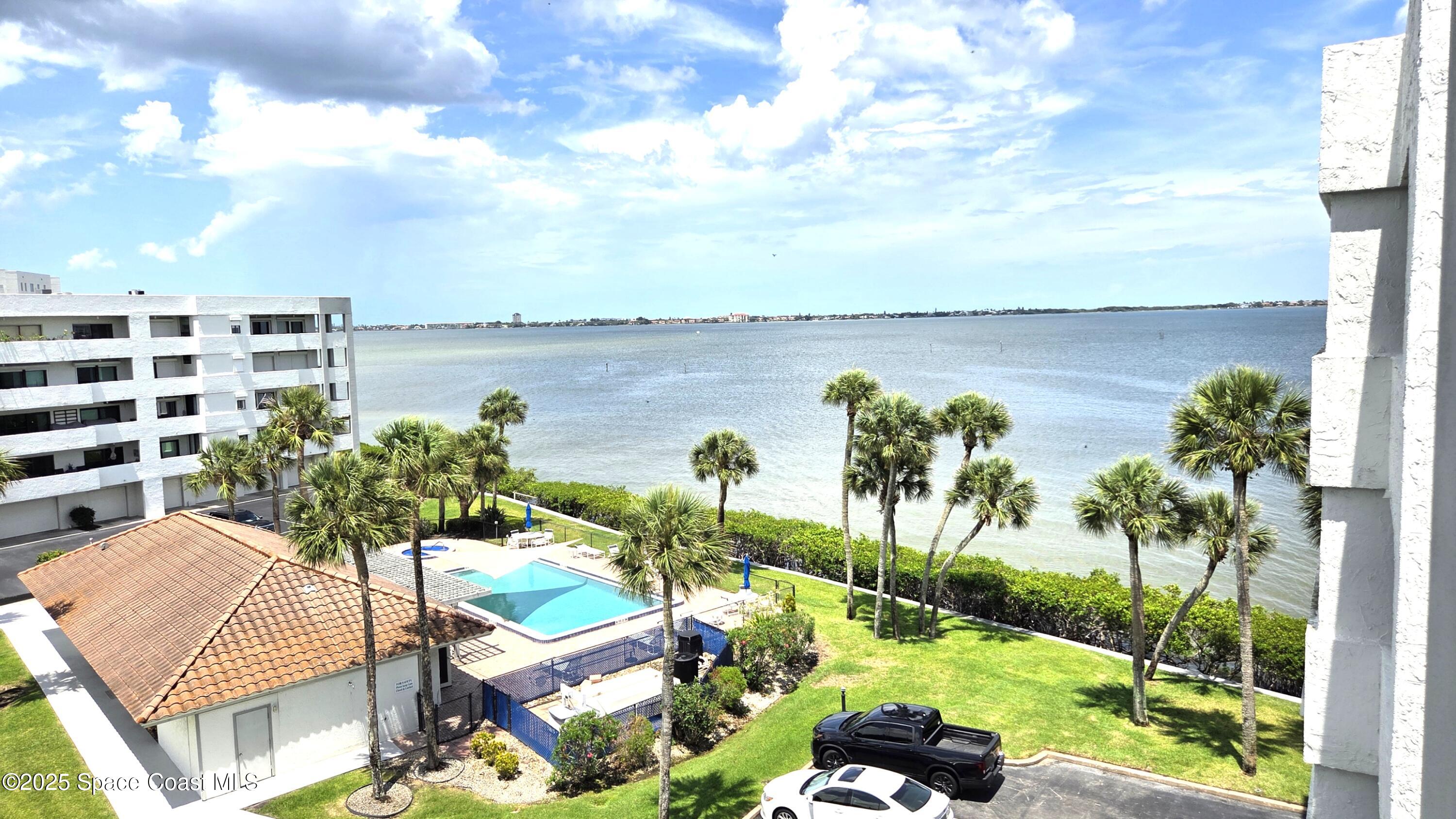 5055 Old Dixie Highway, Unit 403 Palm Bay, FL 32905 - Photo 23 of 32 a view of a lake from a balcony with seating space