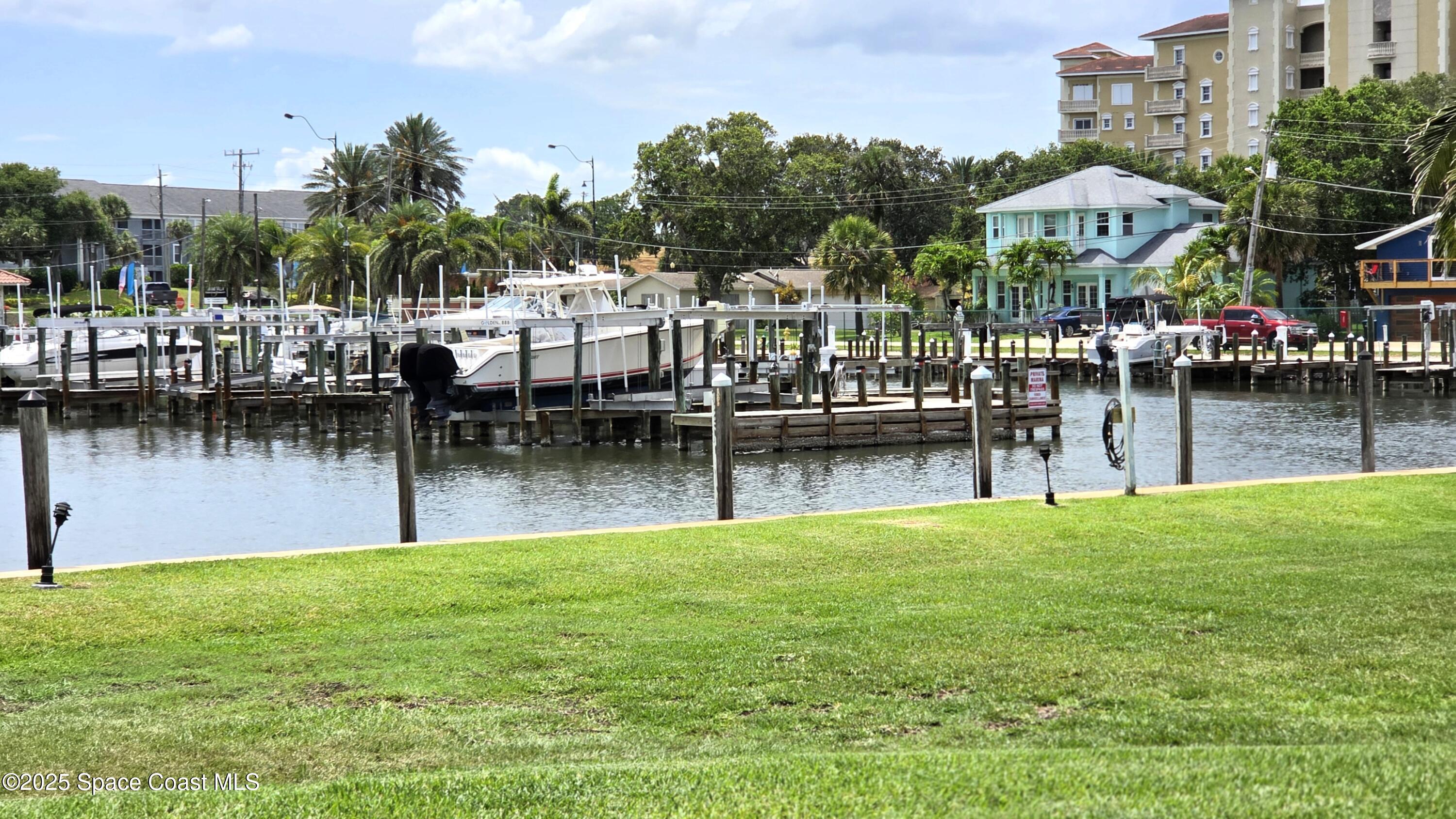 5055 Old Dixie Highway, Unit 403 Palm Bay, FL 32905 - Photo 31 of 32 a view of a lake with houses