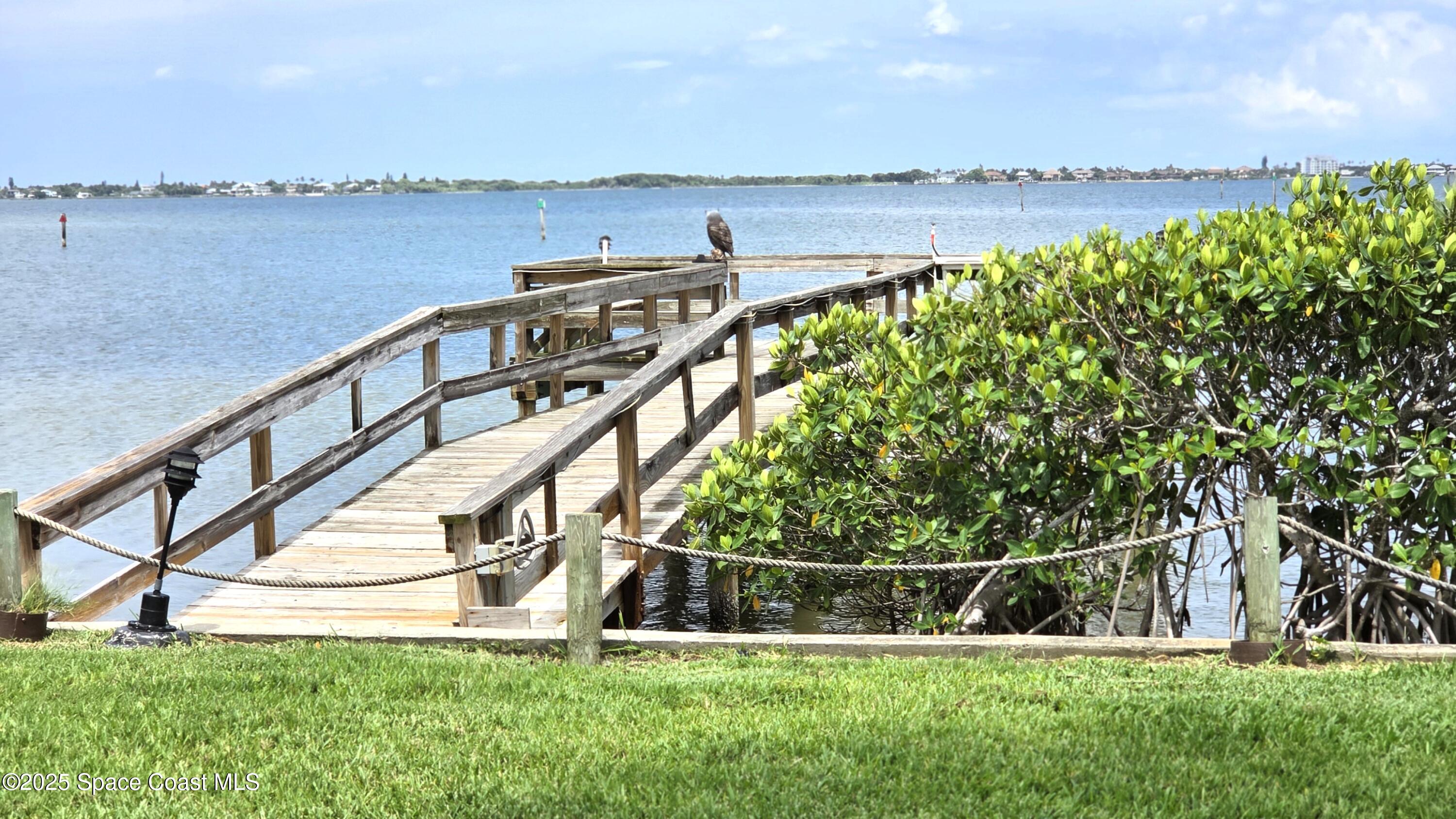 5055 Old Dixie Highway, Unit 403 Palm Bay, FL 32905 - Photo 32 of 32 a view of outdoor space with seating area and trees around