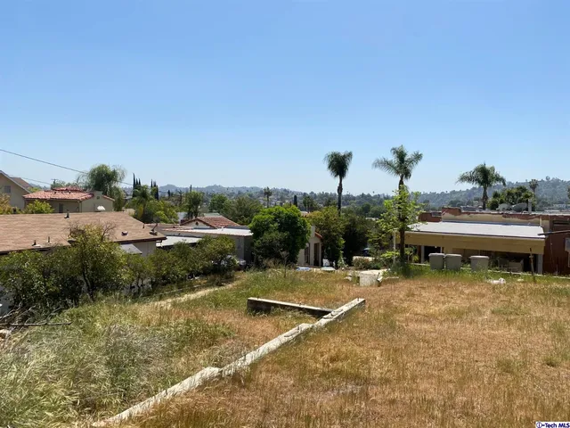 a view of a lake with a yard