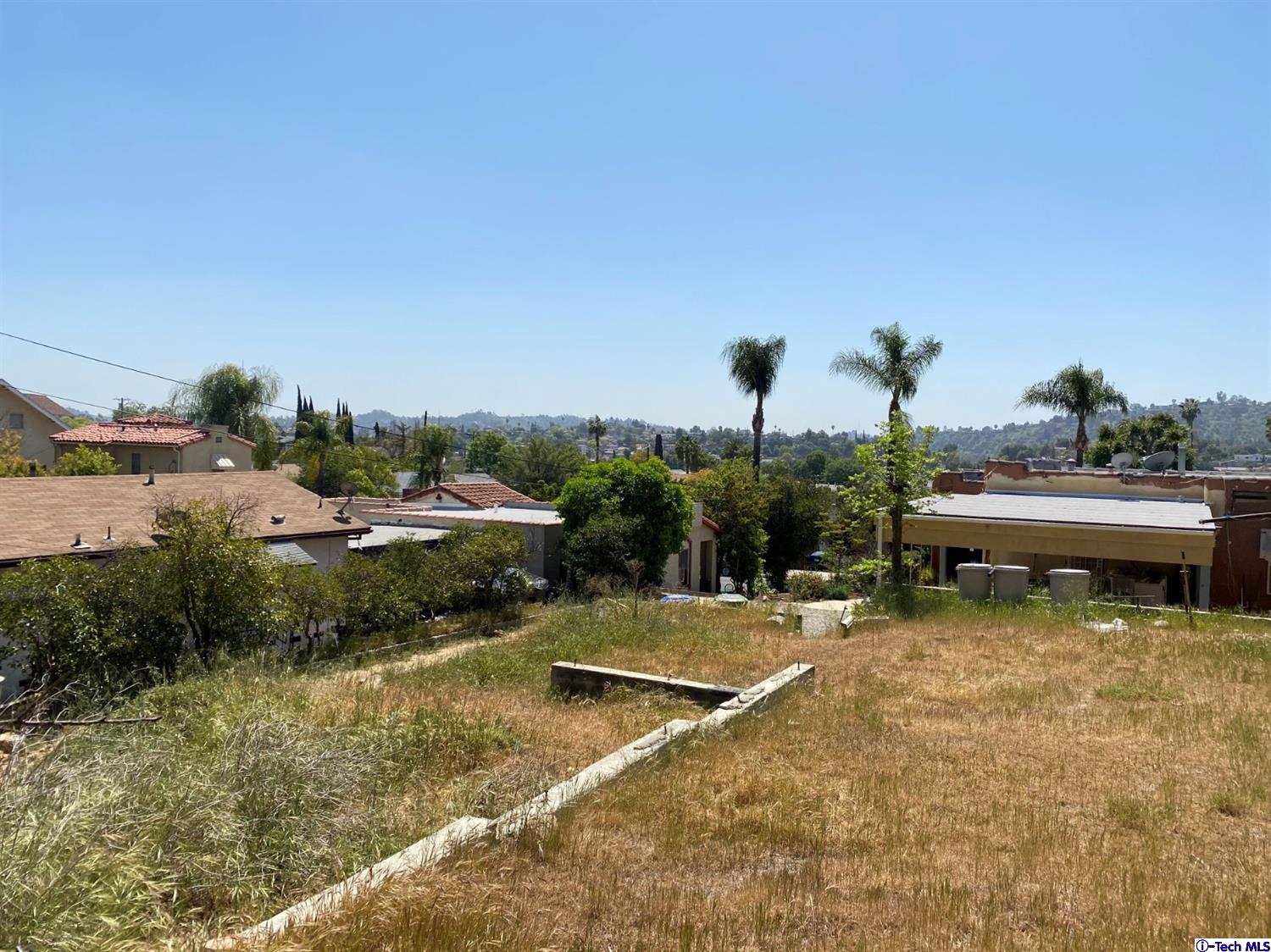 1609 Rueda Drive Los Angeles, CA 90042 - Photo 1 of 8 a view of a lake with a yard