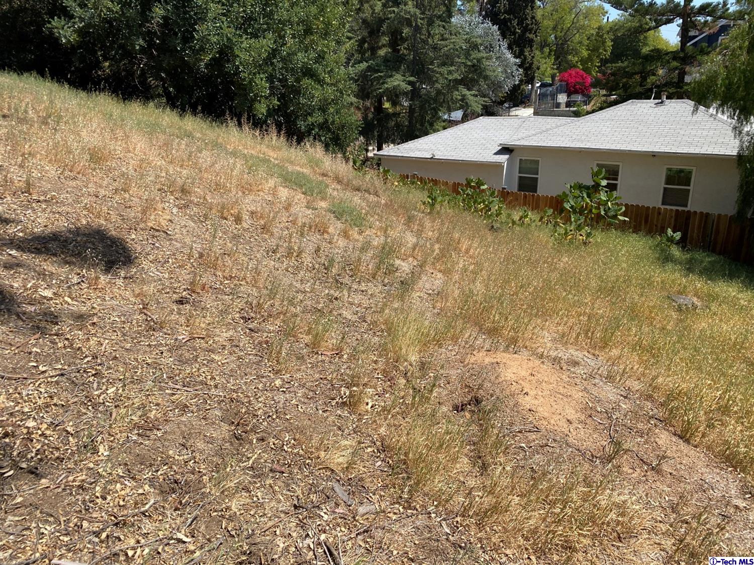 1609 Rueda Drive Los Angeles, CA 90042 - Photo 7 of 8 a view of a house with a yard and sitting area