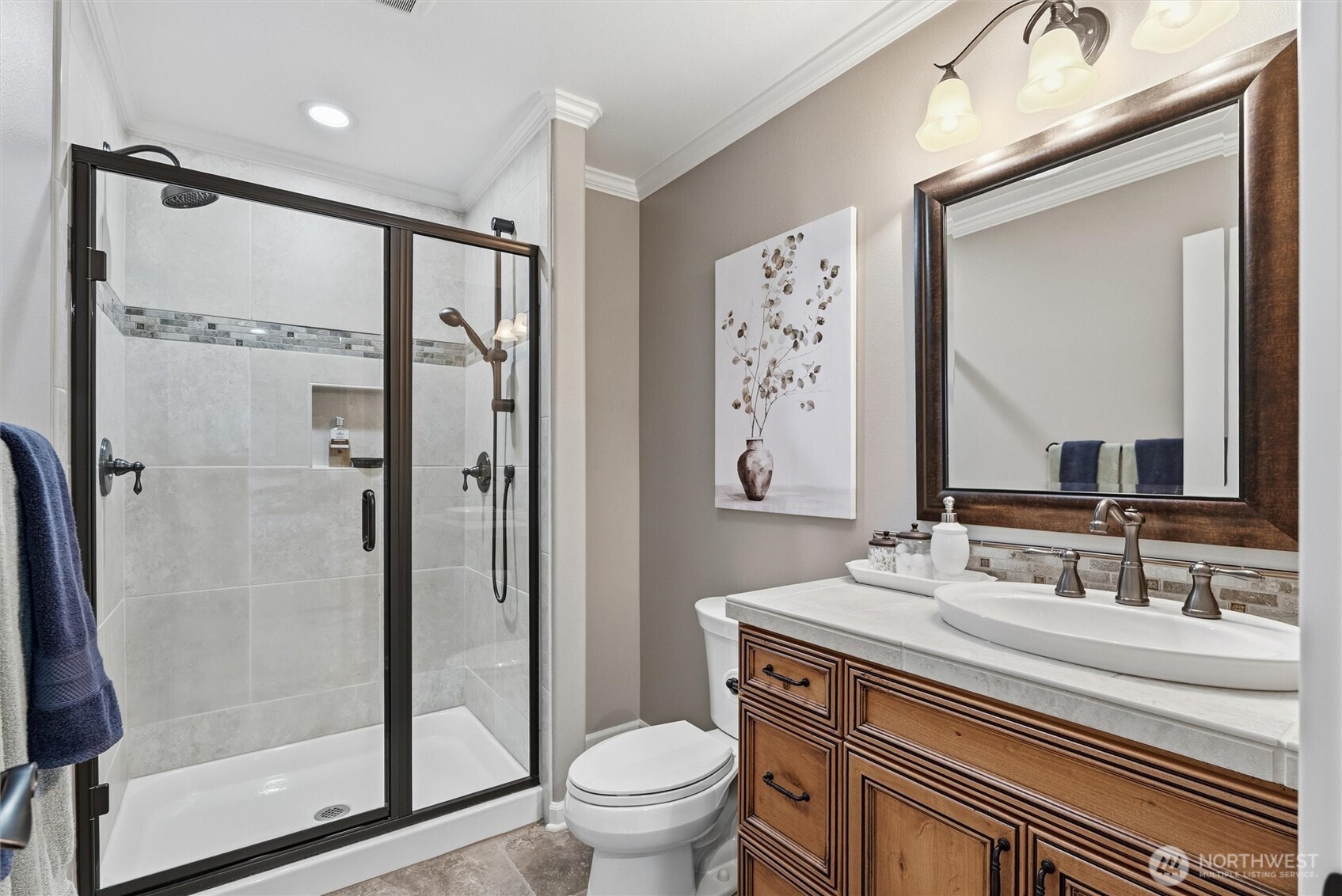 13232 84th Street Southeast Snohomish, WA 98290 - Photo 25 of 40 a bathroom with a granite countertop sink a mirror a toilet and shower