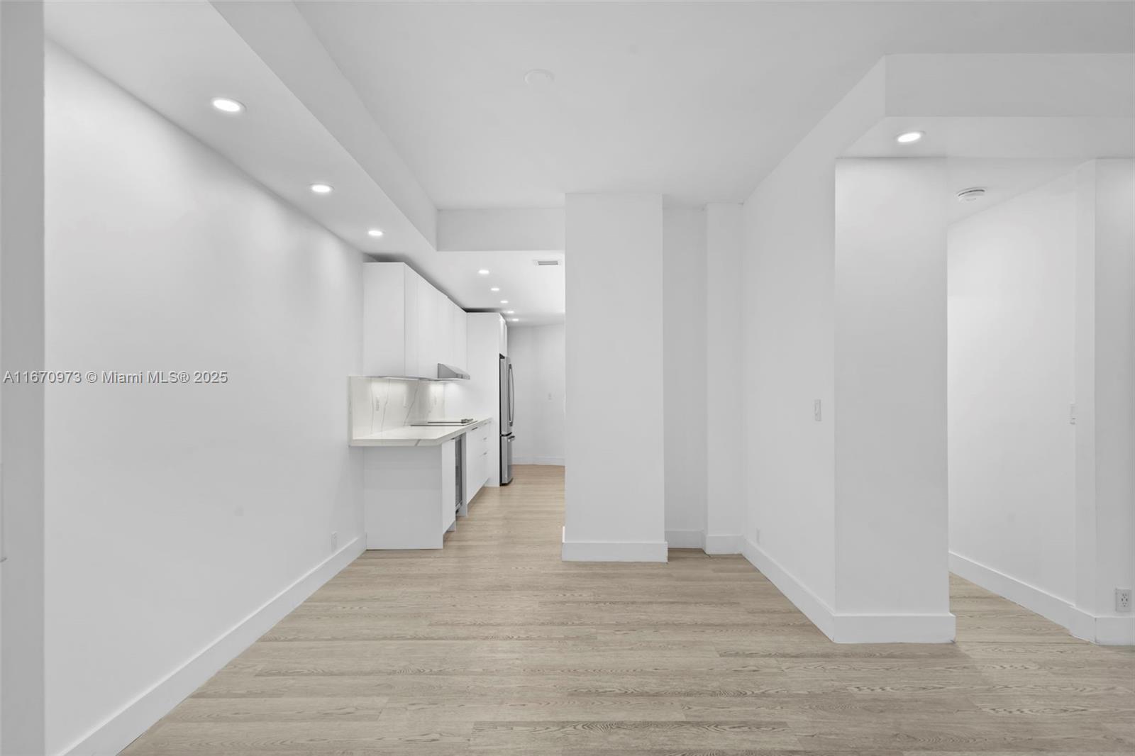 1121 Crandon Boulevard, Unit E105 Key Biscayne, FL 33149 - Photo 11 of 43 a view of a kitchen with wooden floor